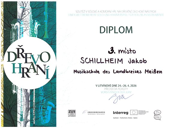 Das Bild zeigt ein farbig gestaltetes Diplom des internationalen Holzbläserwettbewerbs „Dřevohraní“. In der Mitte steht groß „Diplom – 3. místo“.